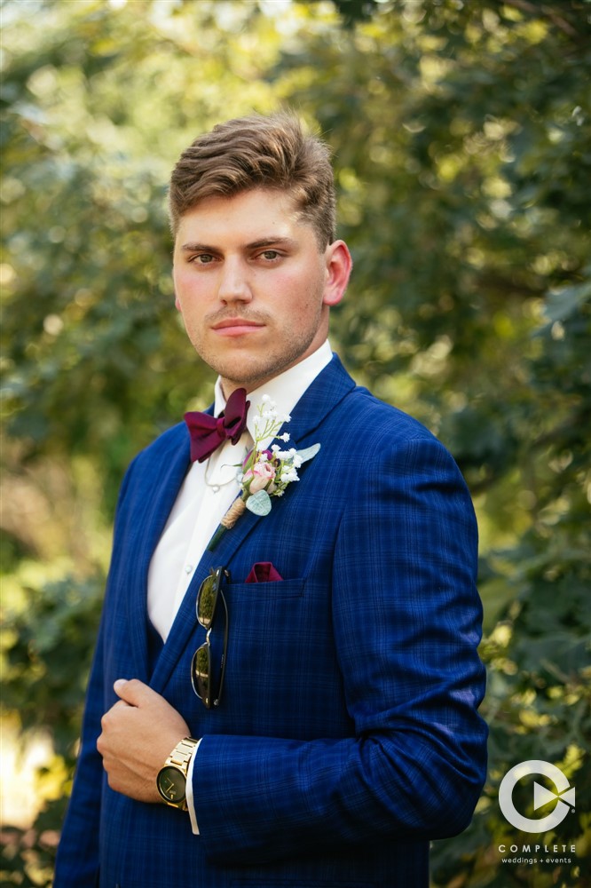 blue suit on groom