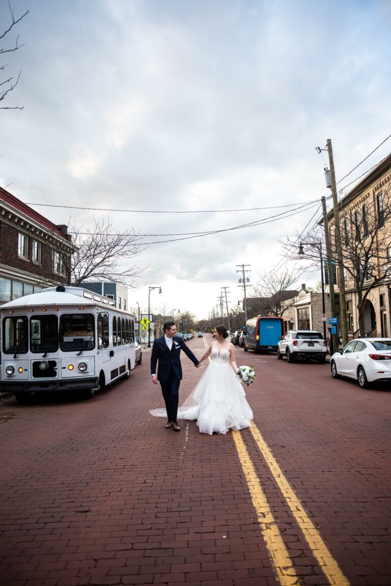 Bride & Groom Walking Down the Street Photography by Rachael Gage