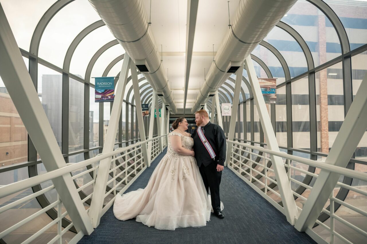 Bride and groom in a hall way