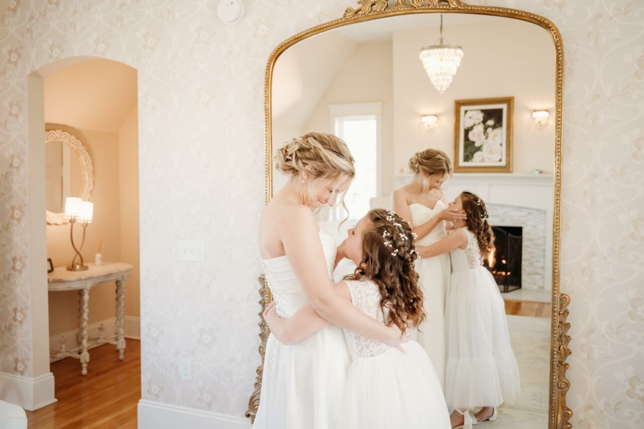 Bride with junior bridesmaid Photography by Lena Stefon