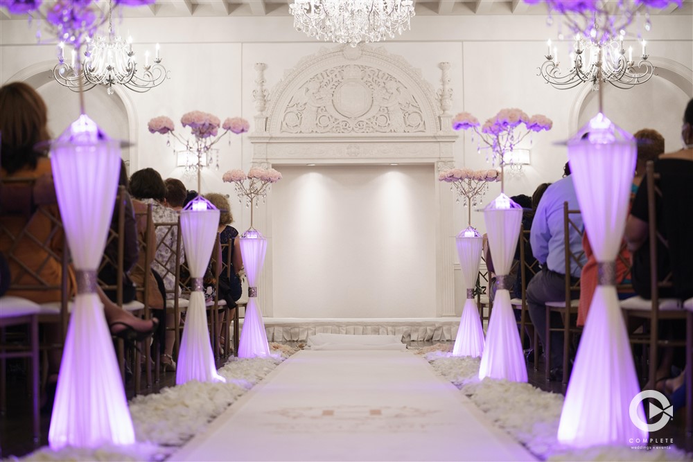 fancy wedding ceremony with lighting down aisle
