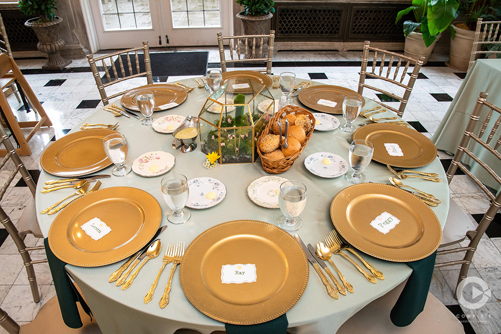 table with gold and sage wedding colors