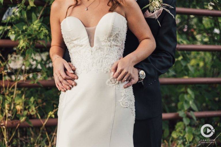 groom holds bride
