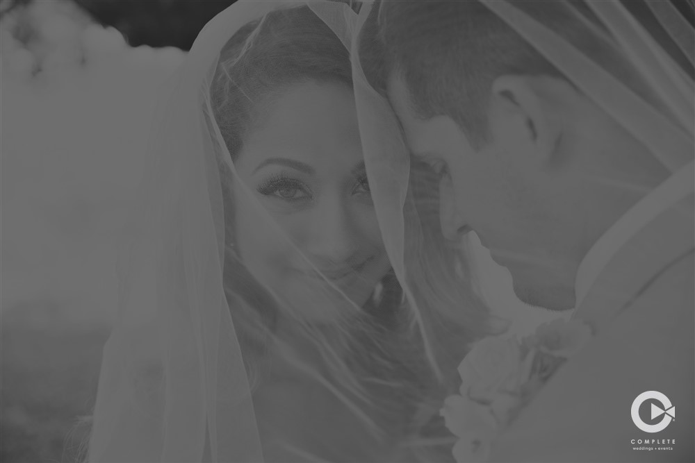 bride and groom in veil