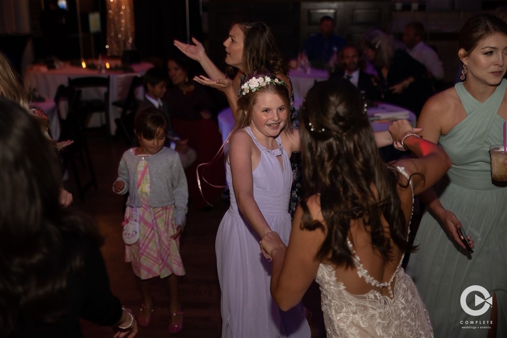 WEDDING MUSIC MISTAKES TO AVOID BRIDE DANCES WITH FLOWER GIRL DURING SPECIAL MOMENT AT WEDDING IN INDIANAPOLIS