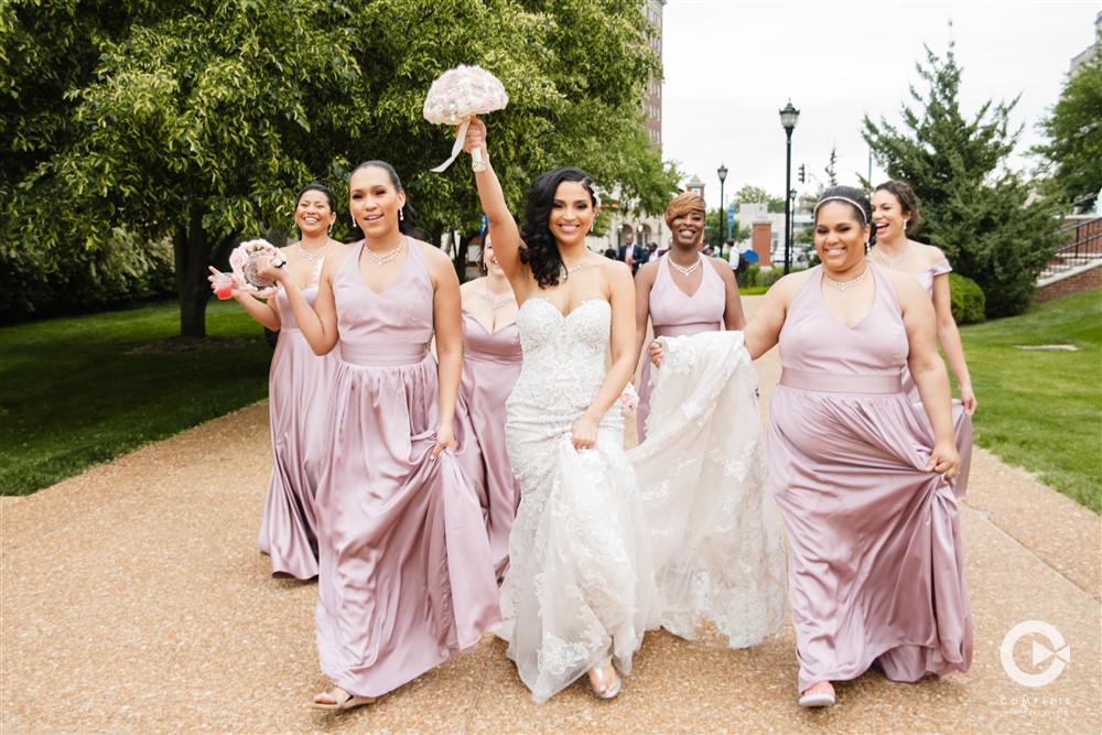 bridesmaids walking down the street with bride