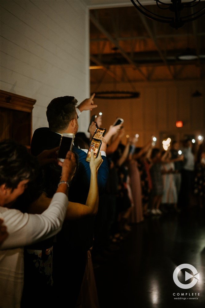 phone flashes at wedding