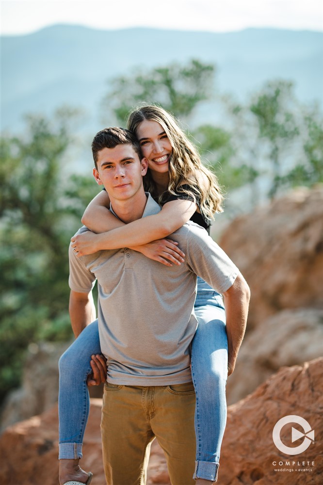 young couple pose for engagement photos