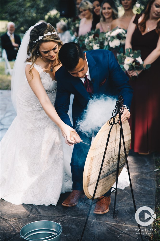 Bride and groom unity ceremony during Laytn's Land-n wedding gorgeous Fall outdoor wedding