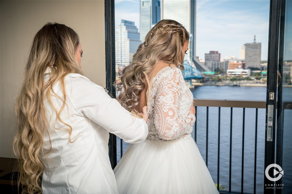 Treaty Park wedding getting ready photo of bride while getting dress on