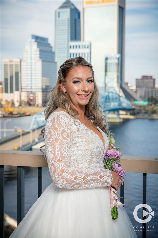 Bride portrait in hotel room before January outdoor wedding ceremony