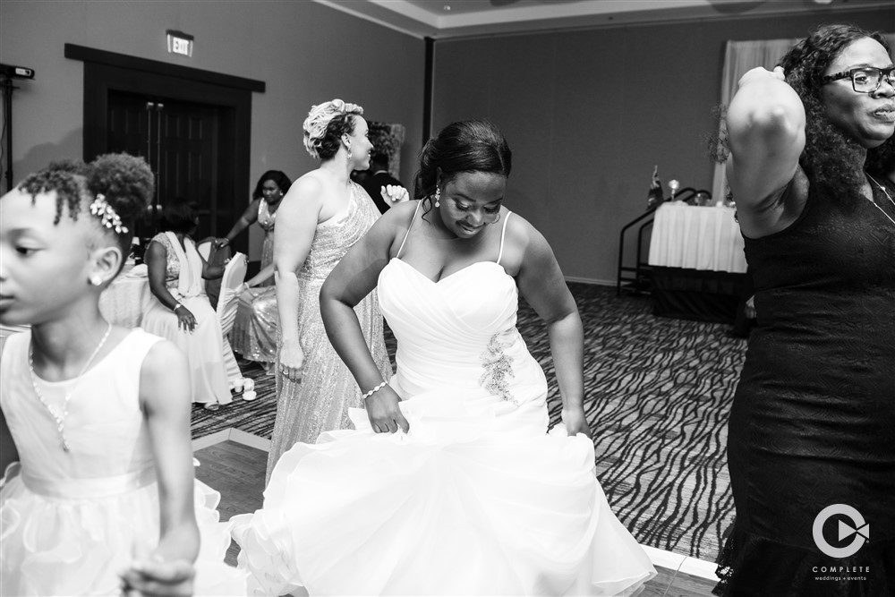 Bride in a black and white photo dancing during open dance at a Jacksonville Wedding