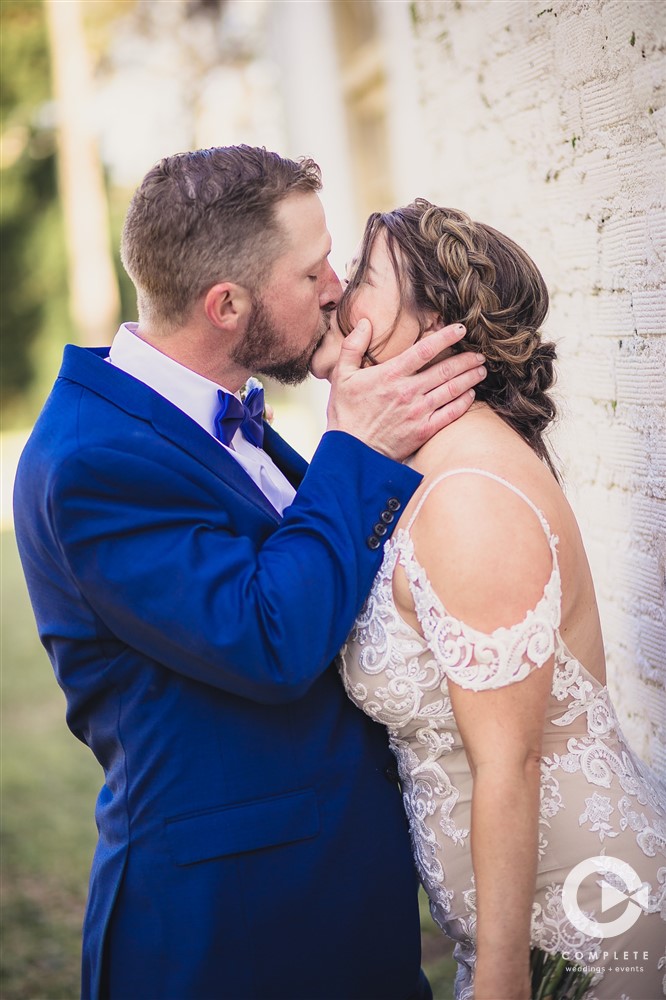Bride and groom kissing during wedding at Ribault Club gorgeous wedding photo