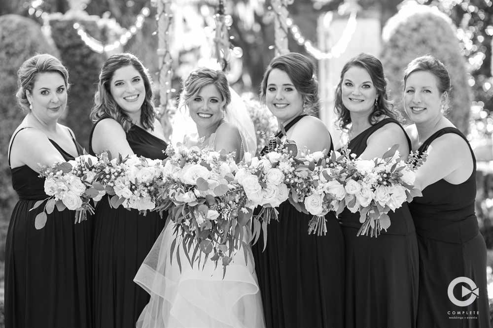 Black and white photo bride with bridesmaids in Jacksonville, FL
