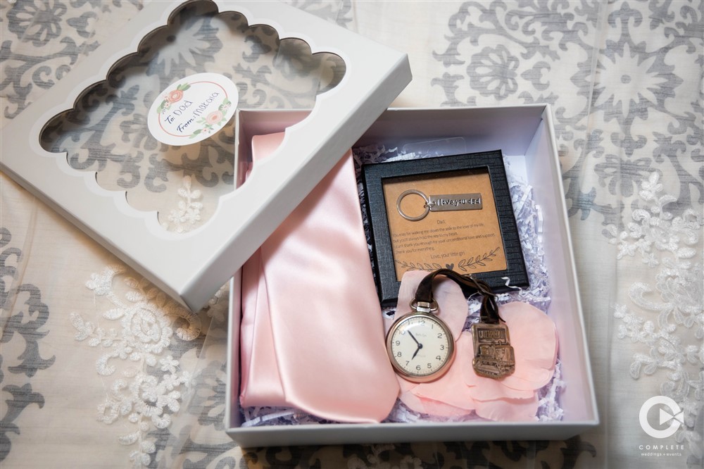 Wedding detail photo at Town Hall Event Center clock and bridal details