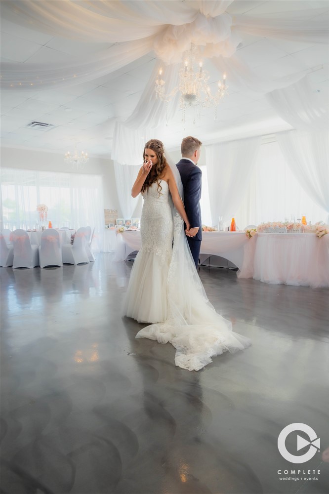 Bride and groom standing back to back reading their wedding vows cute wedding moment