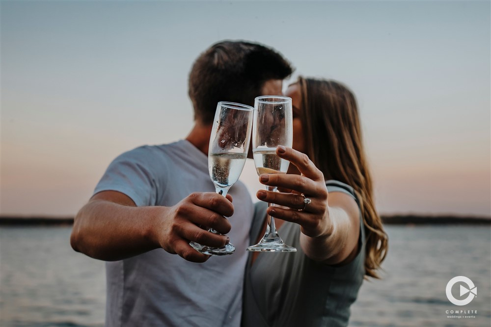 Cheers champagne at engagement session