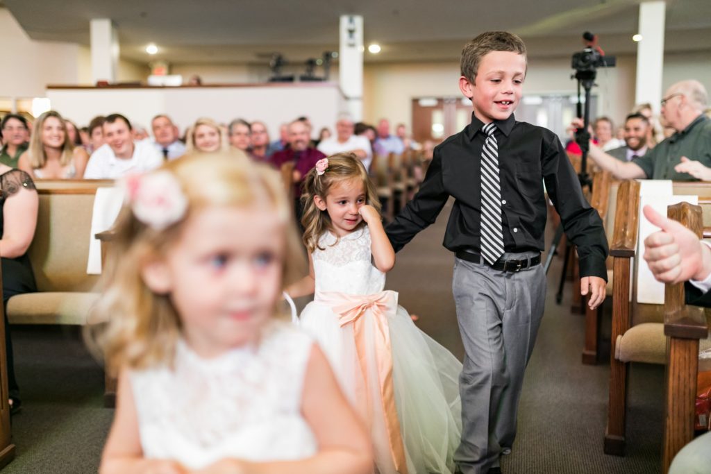Flower girls making their way down the isle for a Kansas City wedding.
