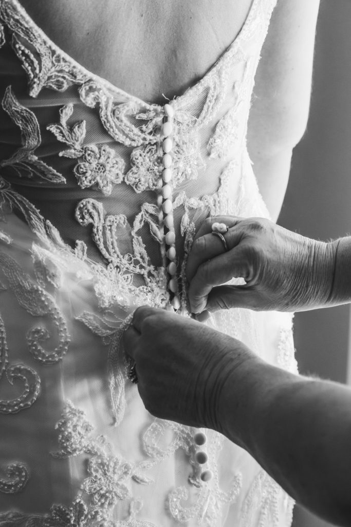 So many buttons on the amazing wedding dress.