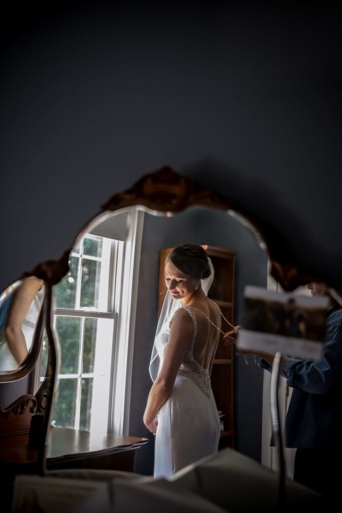 Reflection of Bride in antique mirror