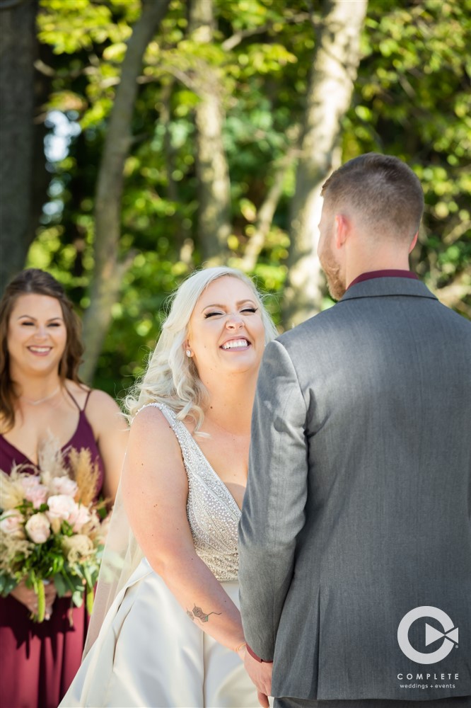 bride smiling during ceremony