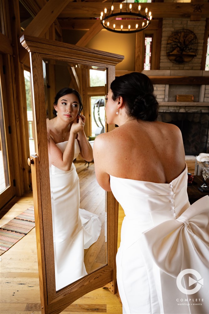 Bride putting on jewelry