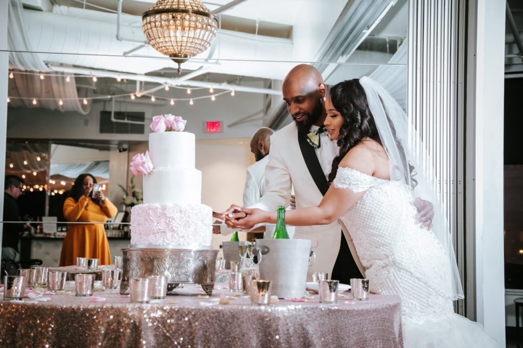 Bride and groom cut their wedding cake
