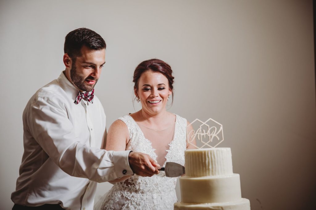 Bride and groom cut their cake