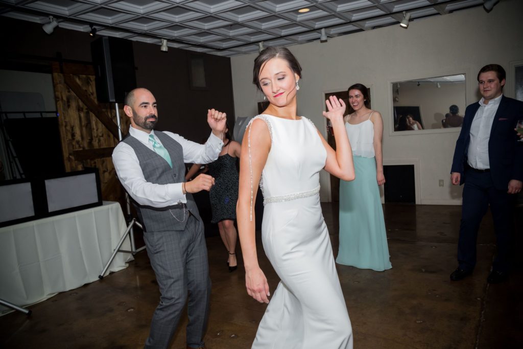 Bride and groom dancing at their spring wedding reception at The Martin Event Space