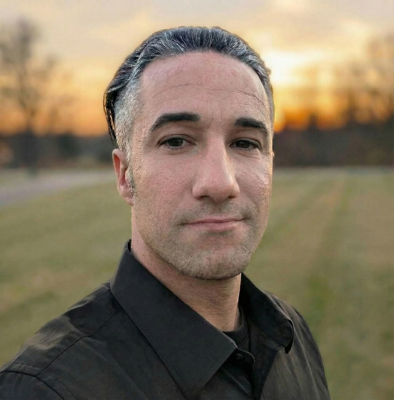 Headshot of Kylan, a wedding videographer for Complete Headshot of Kylan, videographer for Complete Weddings + Events.