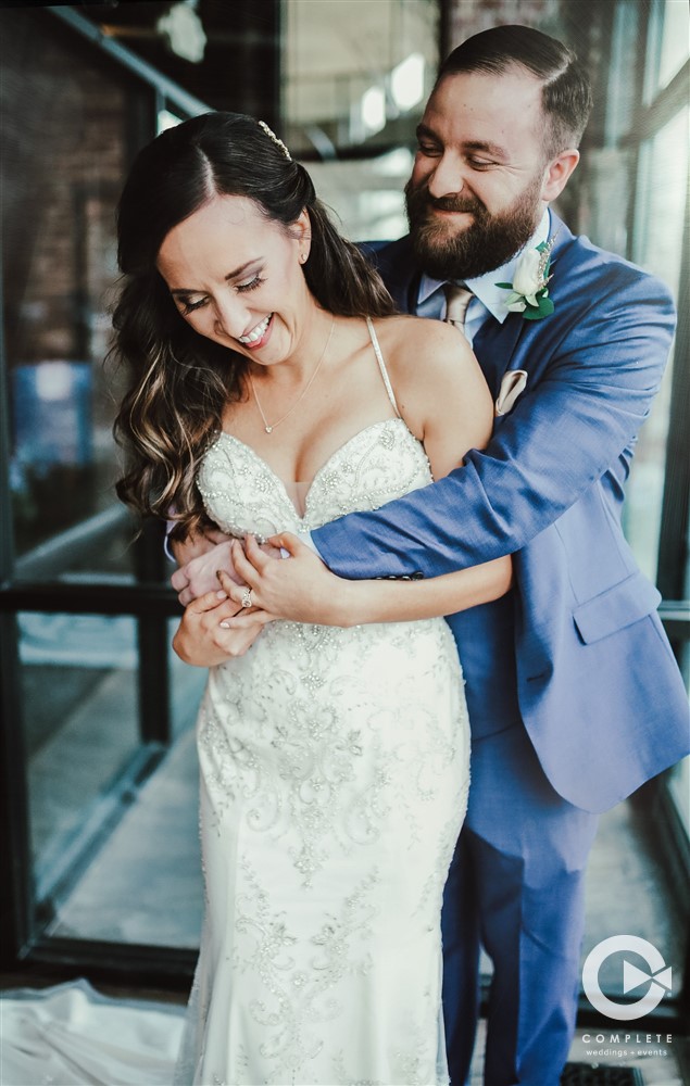 Bride and groom hugging during Kearney NE wedding reception gorgeous couple