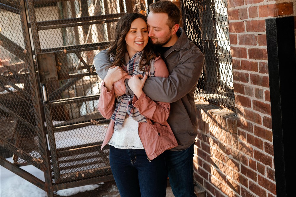 Engagement photo session with couple wearing trendy clothes