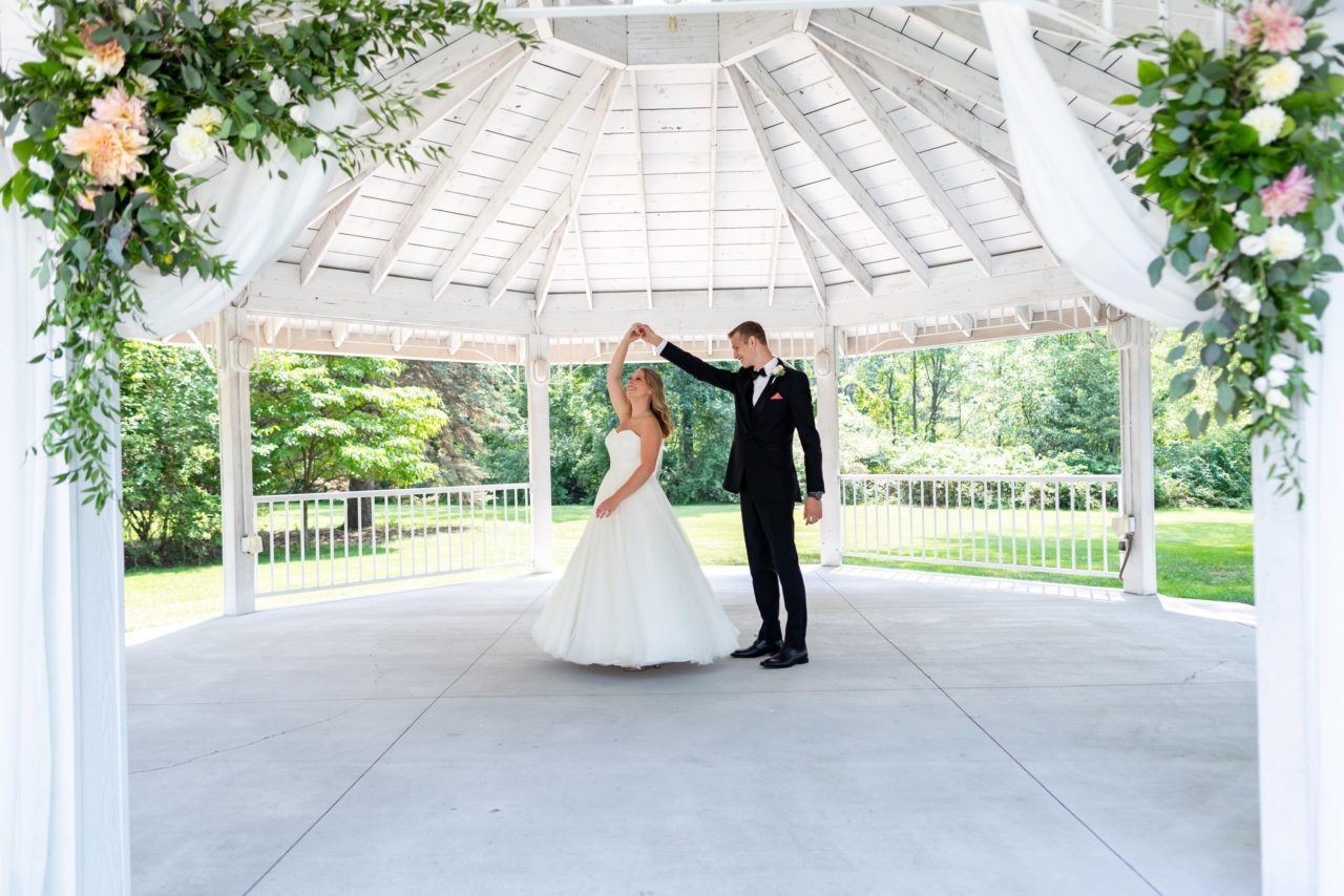 bride and groom twirl