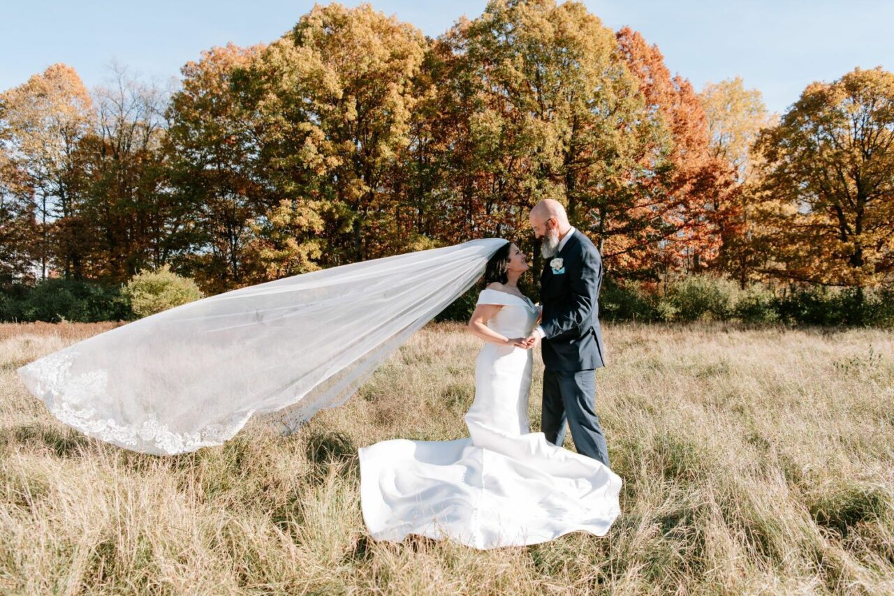 Bride & Groom in fall field