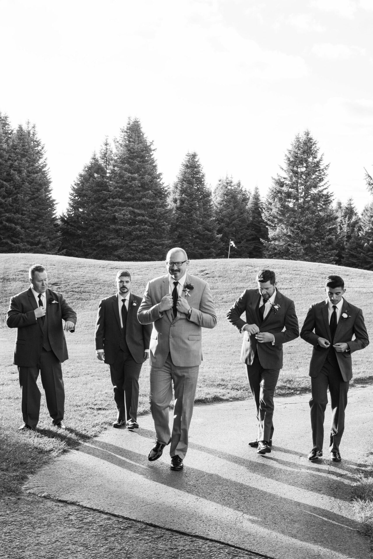 Black and White image of groom with his groomsmen