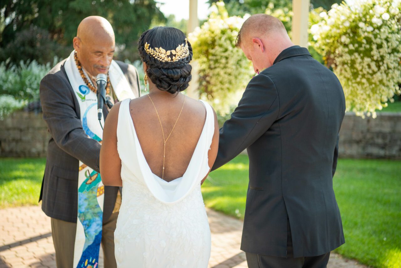 Bride & Groom in front of pastor