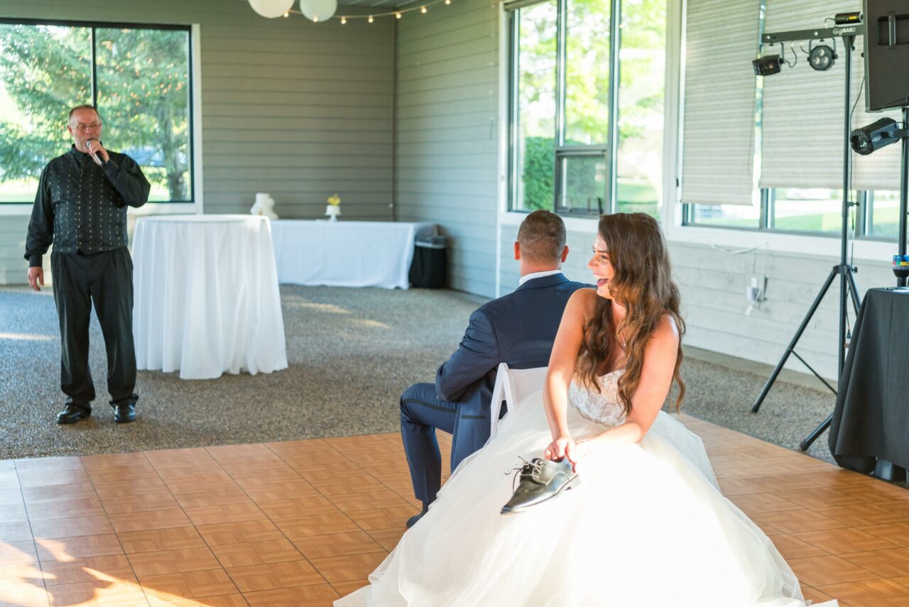 Bride & Groom Playing the Shoe Game