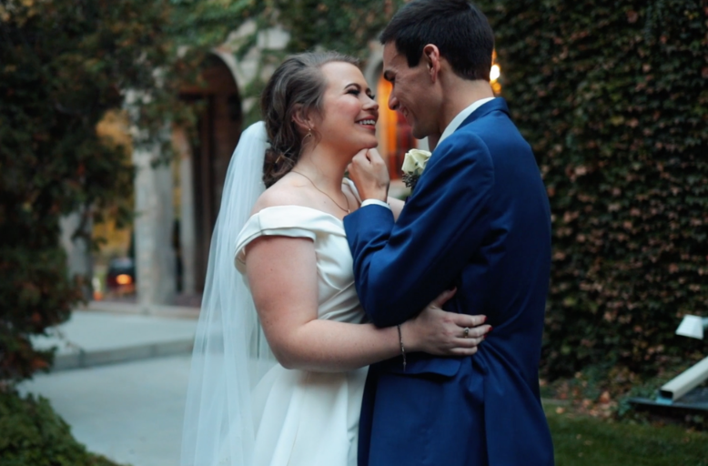 Nichole + Andrew At The Embassy Suites Bride in off the shoulder dress and groom in navy blue suit.