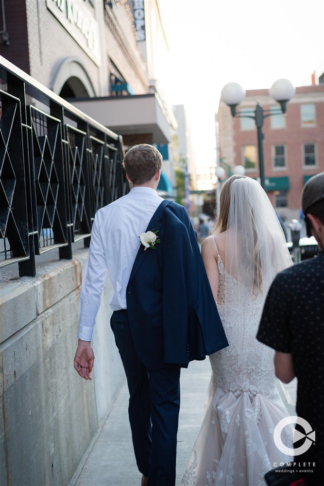 bride and groom walking at Wedding in Downtown Lincoln