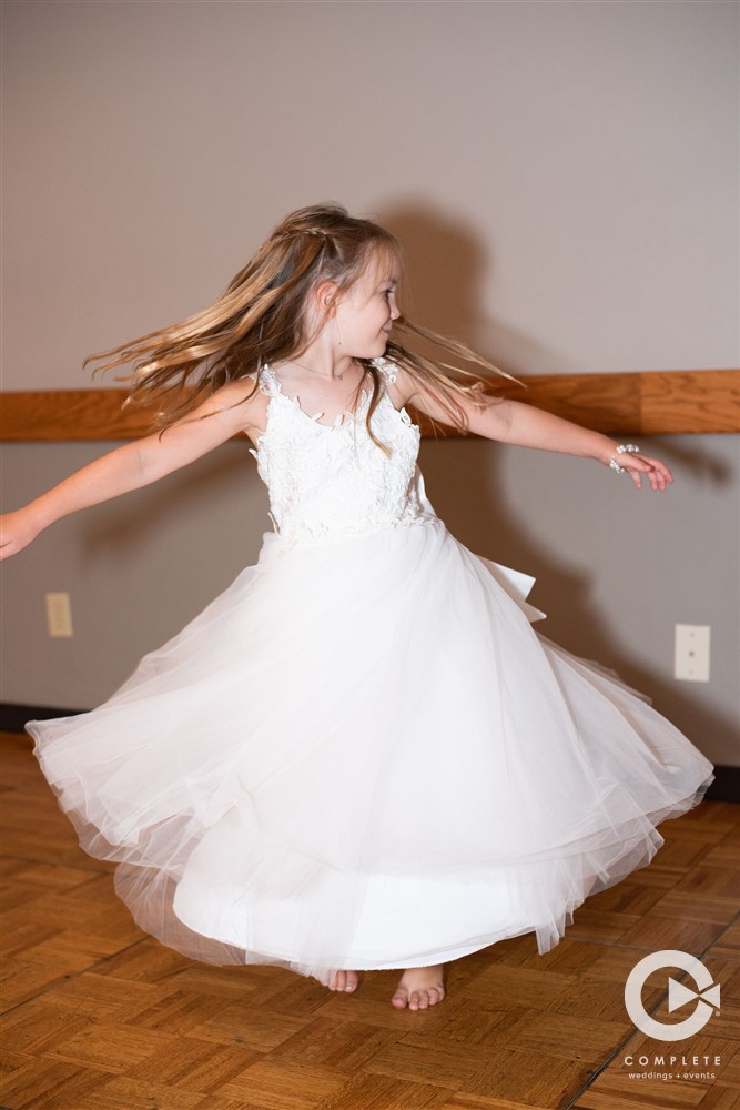 flower girl dancing at Wedding in Downtown Lincoln