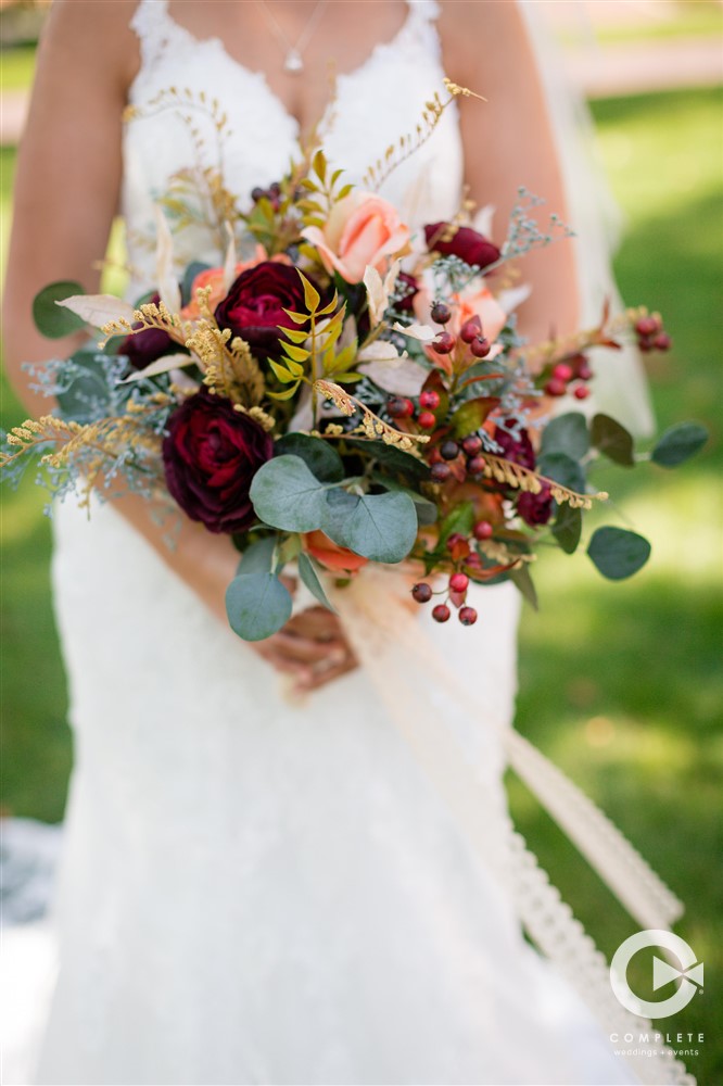 bride hold colorful bouquet