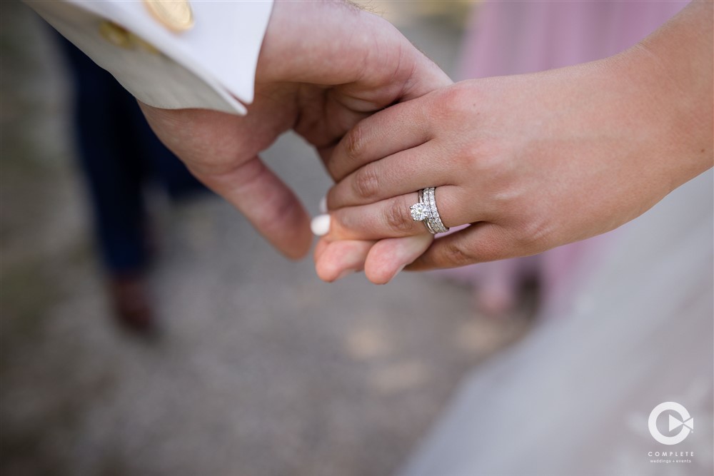 wedding ring holding hands