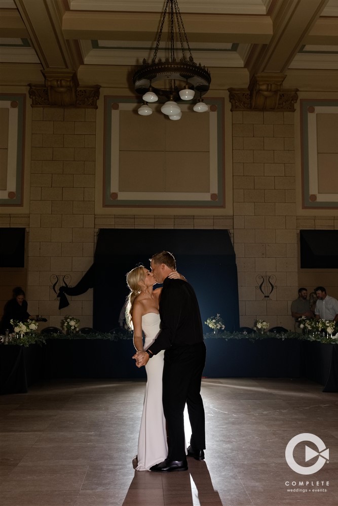 Bride and groom dance at reception