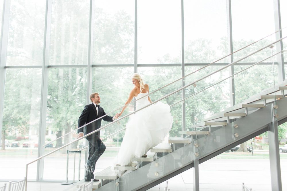 Couple Running Upstairs After Ceremony