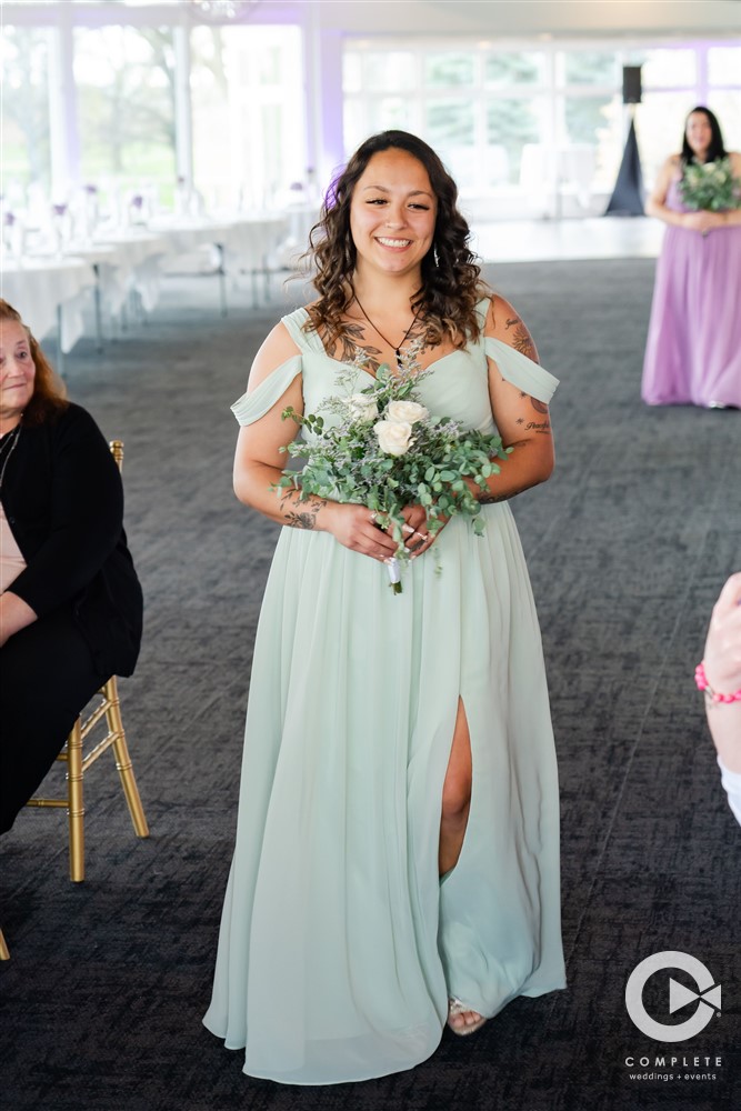 bridesmaid walking down the aisle