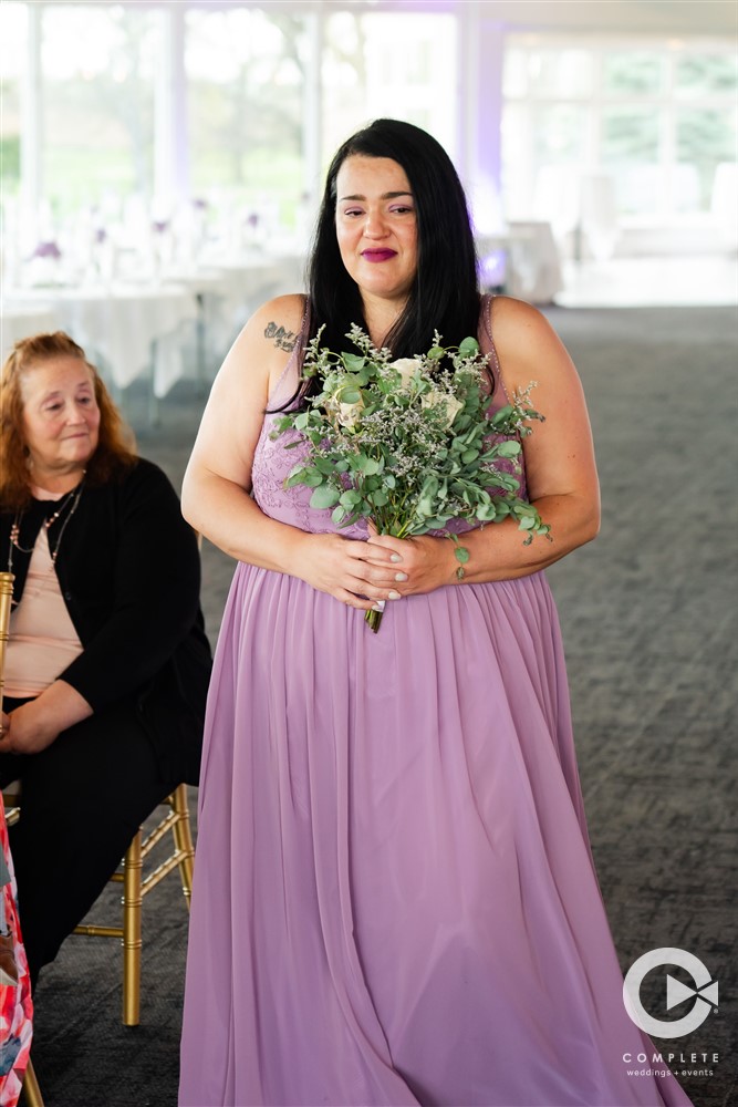 bridesmaid walking down the aisle