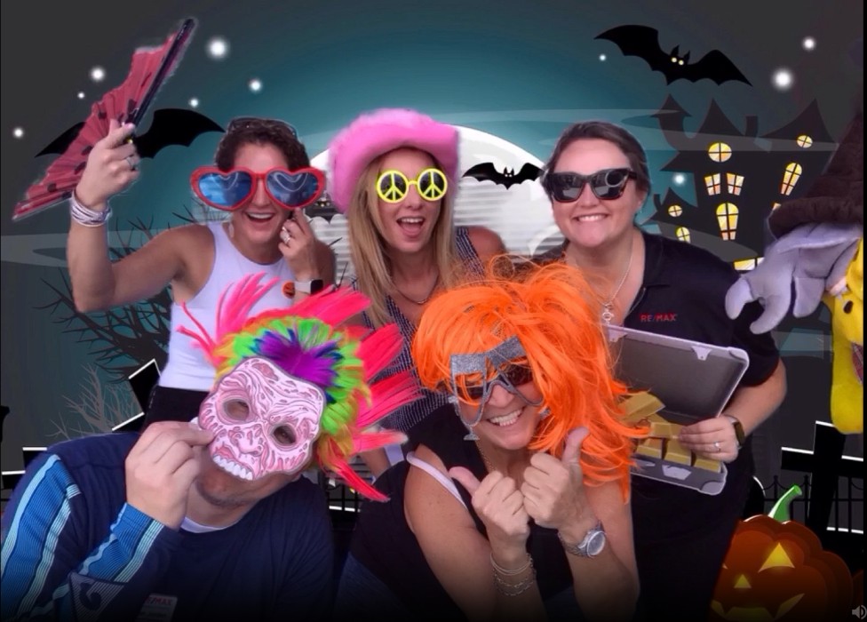 People posing in an epic halloween photo booth