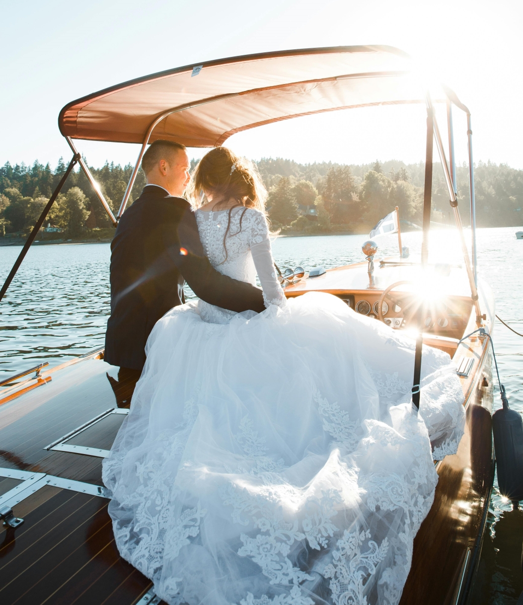 newlyweds on boat embracing adventure