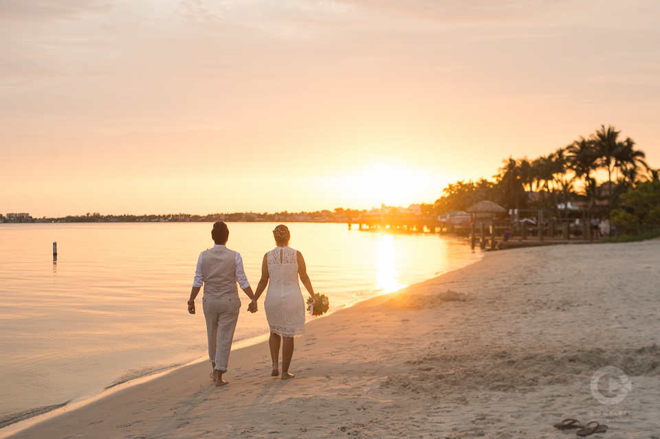 Newlyweds on Beach during golden hour sunset - Golden Hour Wedding Photos