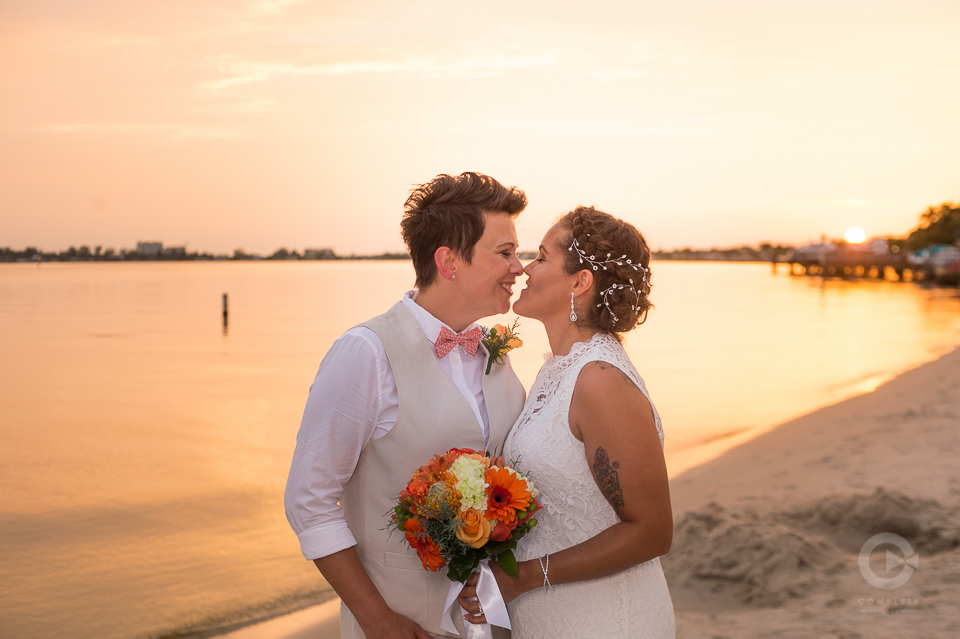 Newlyweds on Beach during golden hour sunset - Golden Hour Wedding Photos